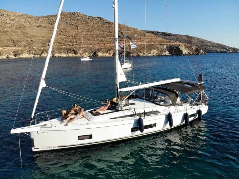Beneteau Oceanis 46.1 - yacht at anchor in a scenic bay, summer lifestyle on board, charter in Greece