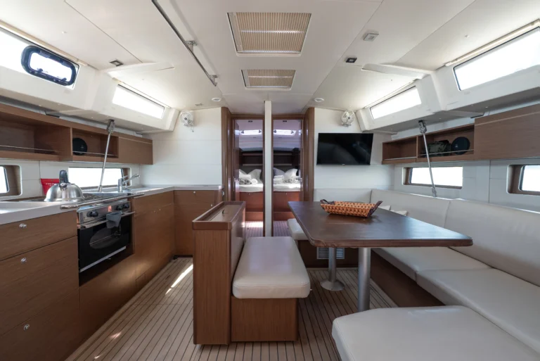 Beneteau Oceanis 46.1 - front view of the saloon with dining area, sailing charter yacht in Greece