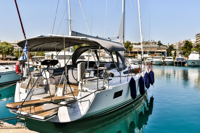 Jeanneau 54 Sea Force starboard side view at marina, yacht charter in Greece