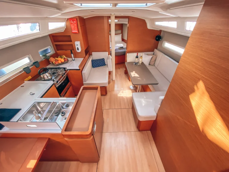 Jeanneau Sun Odyssey 410 Aquaholic interior saloon front view for charter in Greece
