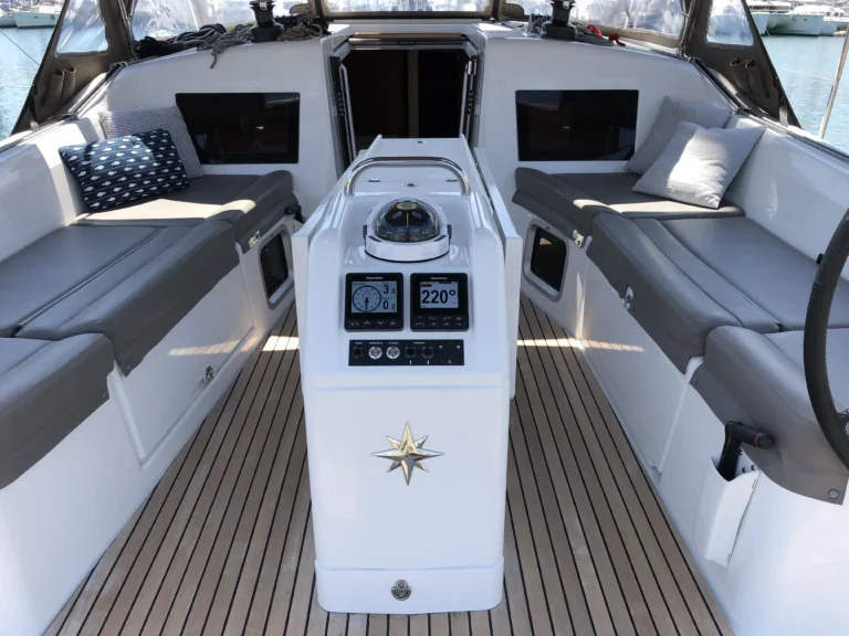 Jeanneau Sun Odyssey 410 Aquaholic cockpit with teak deck and table, charter in Greece