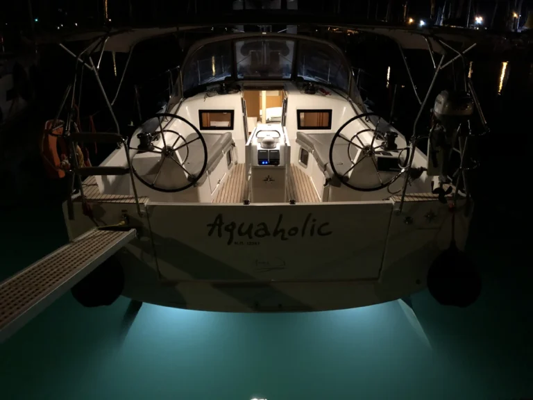 Jeanneau Sun Odyssey 410 Aquaholic stern night view with underwater lights, charter in Greece