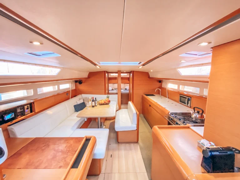 Jeanneau Sun Odyssey 509 Promise - saloon interior front view | Sailing To Go, yacht charter in Greece