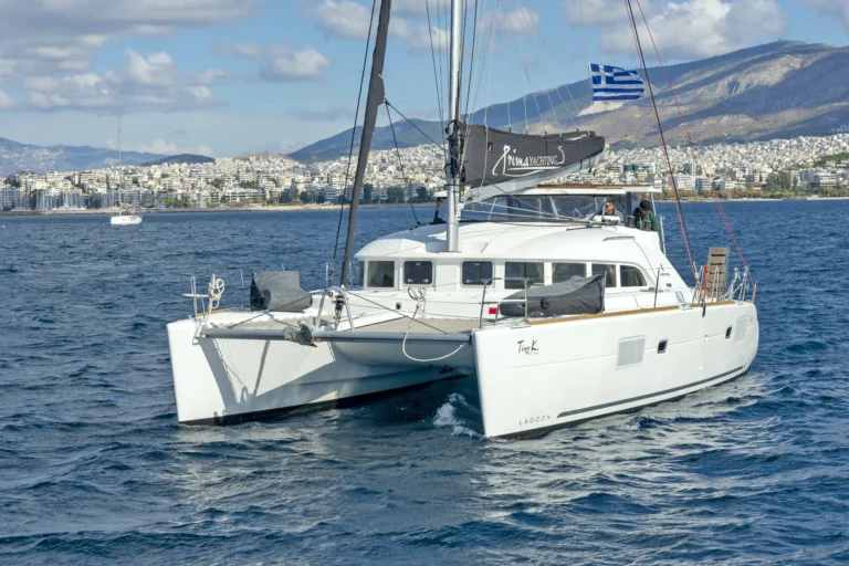 Lagoon 380 Tiny K front view while sailing, catamaran charter in Greece