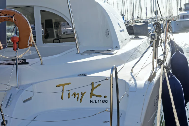 Lagoon 380 Tiny K yacht name on stern, catamaran charter in Greece