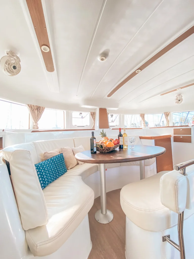 Lagoon 380 Tiny K interior saloon with dining area, catamaran charter in Greece