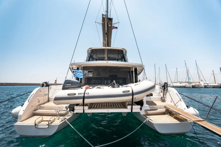 Lagoon 46 Sea Energy I aft view with tender on davits for catamaran charter in Greece
