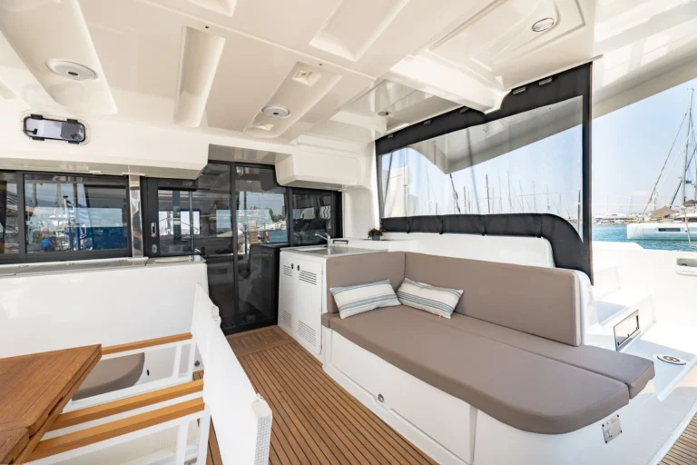 Lagoon 46 Sea Energy I cockpit lounge sofa and access to the saloon for catamaran charter in Greece